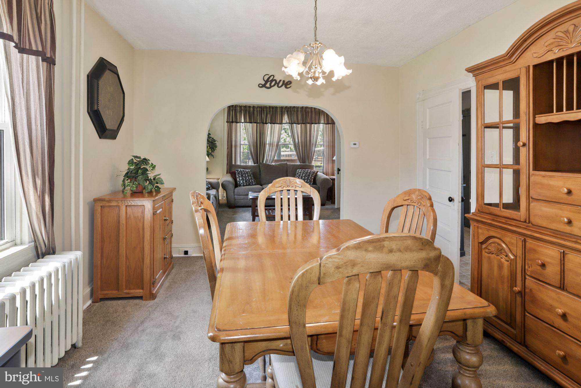 8029 Philadelphia Road Baltimore, MD 21237 - Photo 10 of 29 a view of a dining room with furniture and chandelier