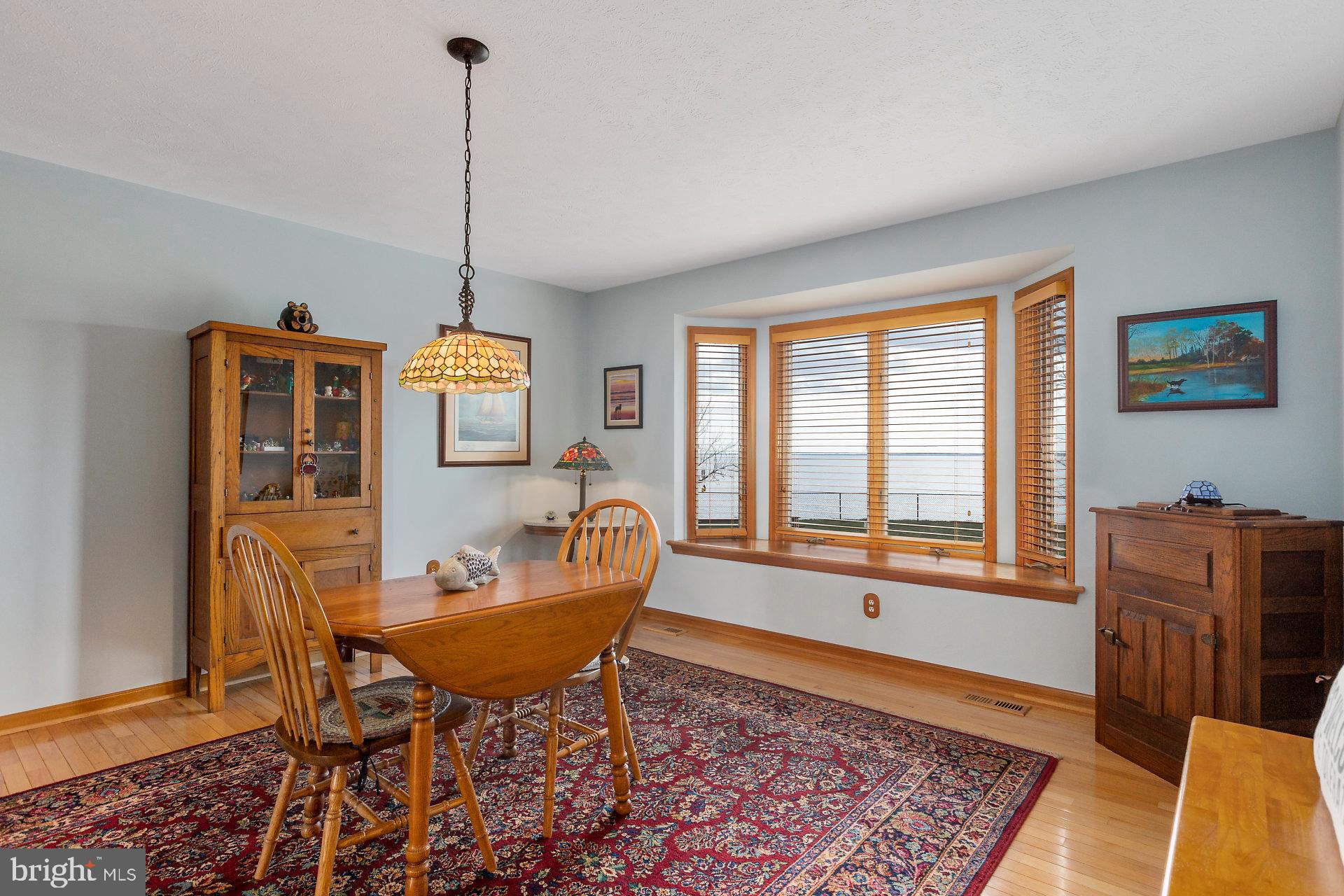 17191 Piney Point Road Piney Point, MD 20674 - Photo 27 of 45 dining room; Andersen windows & doors throughout
