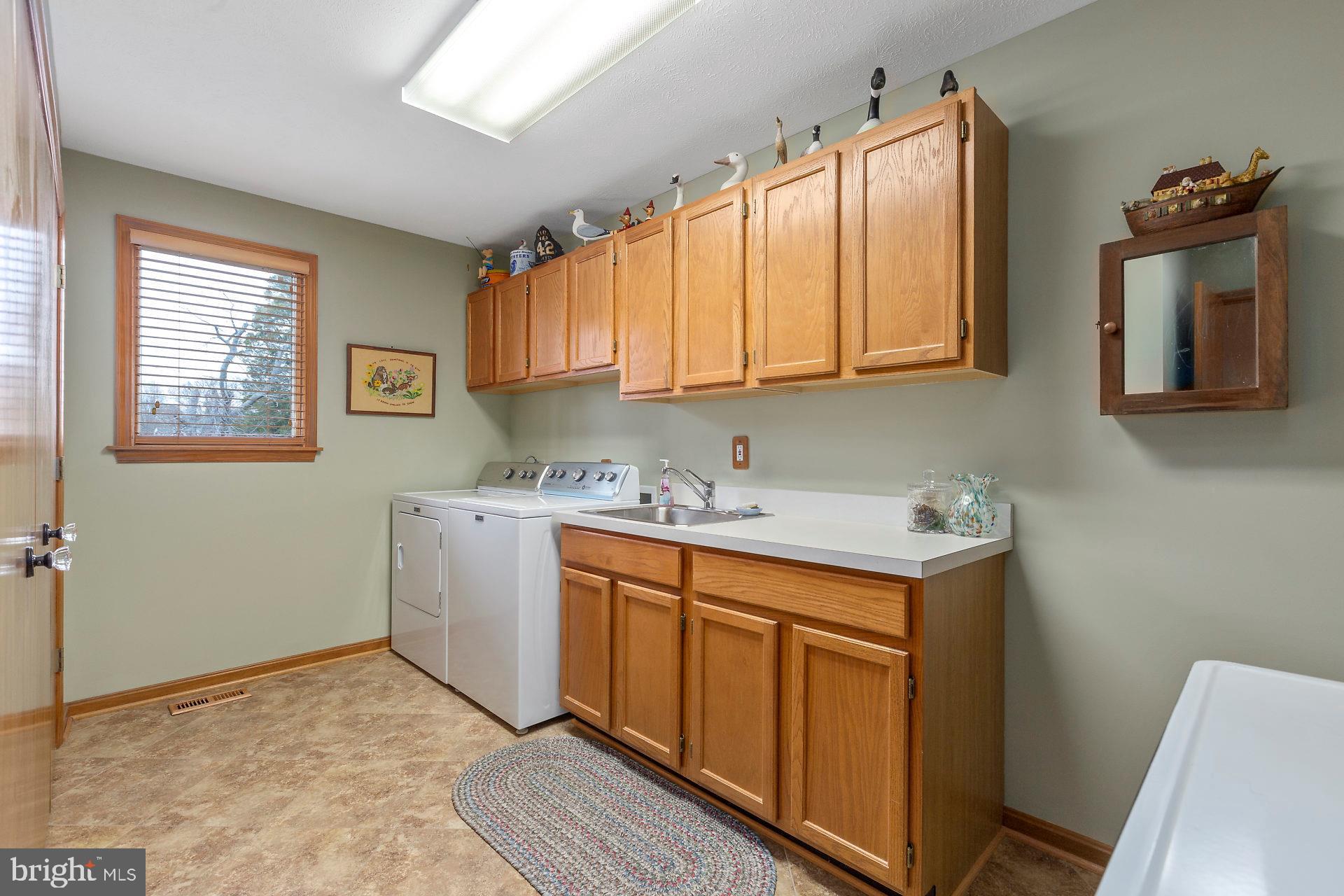 17191 Piney Point Road Piney Point, MD 20674 - Photo 32 of 45 large laundry room with lots of storage