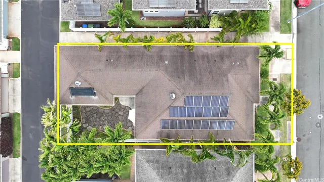 an aerial view of a house with a swimming pool