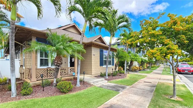 a front view of a house with garden