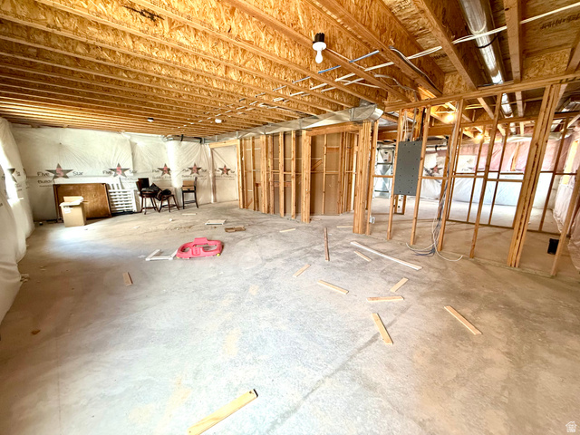 1823 South Longview Road Santaquin, UT 84655 - Photo 62 of 69 Unfinished basement space featuring exposed wood joists and subfloor, concrete flooring, and partial wood framing for future rooms