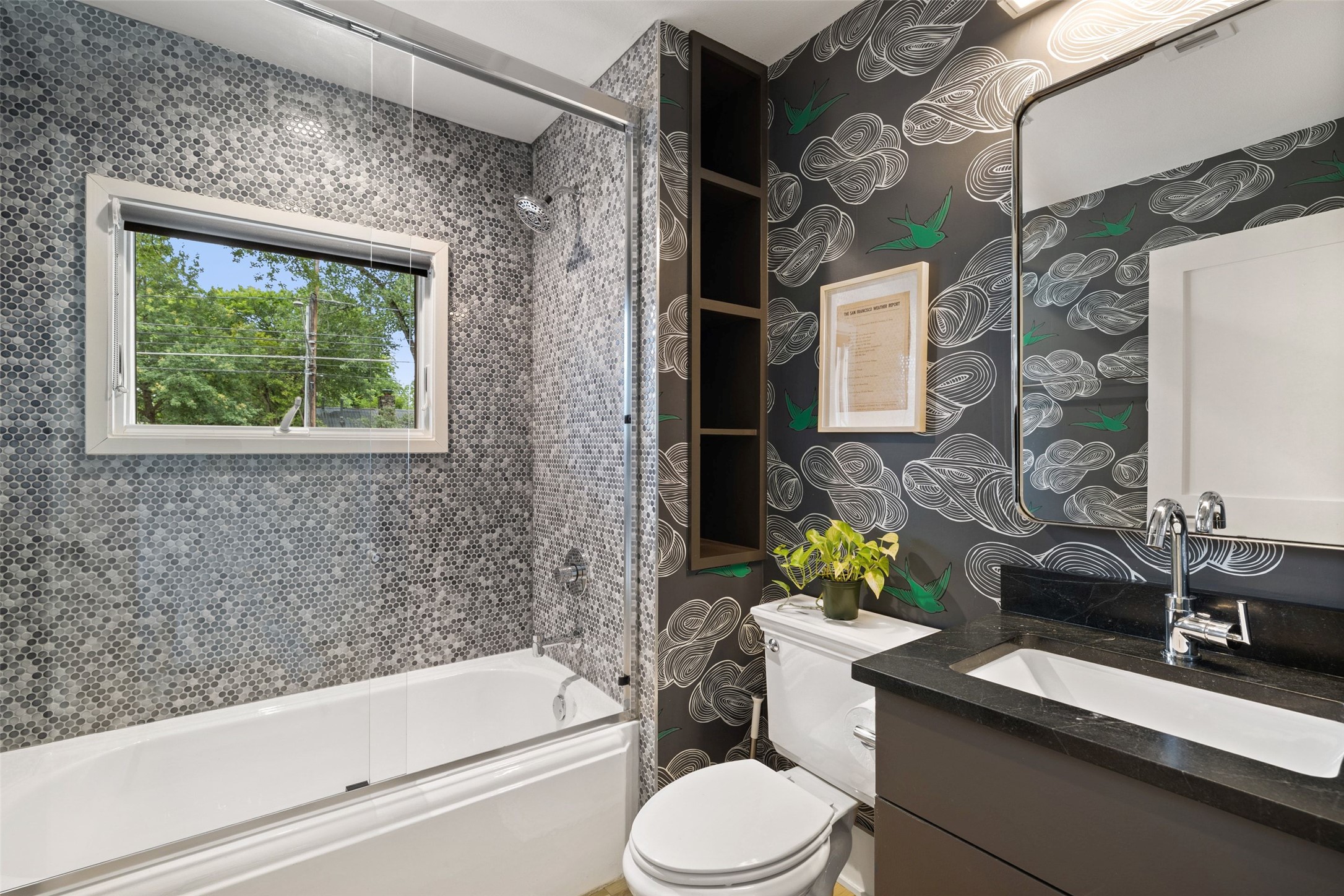 2000 Rundell Place Austin, TX 78704 - Photo 16 of 38 Stylish bathroom with mosaic tile shower surround and a captivating accent wall.