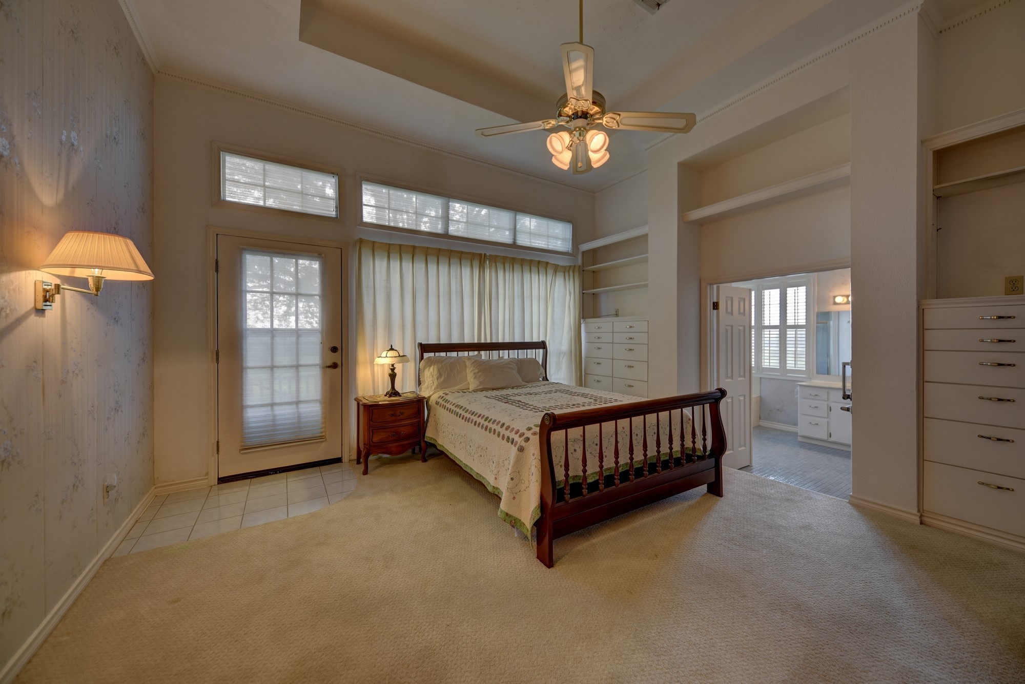 1552 Holub Road Schulenburg, TX 78956 - Photo 14 of 43 a spacious bedroom with a bed and a chandelier