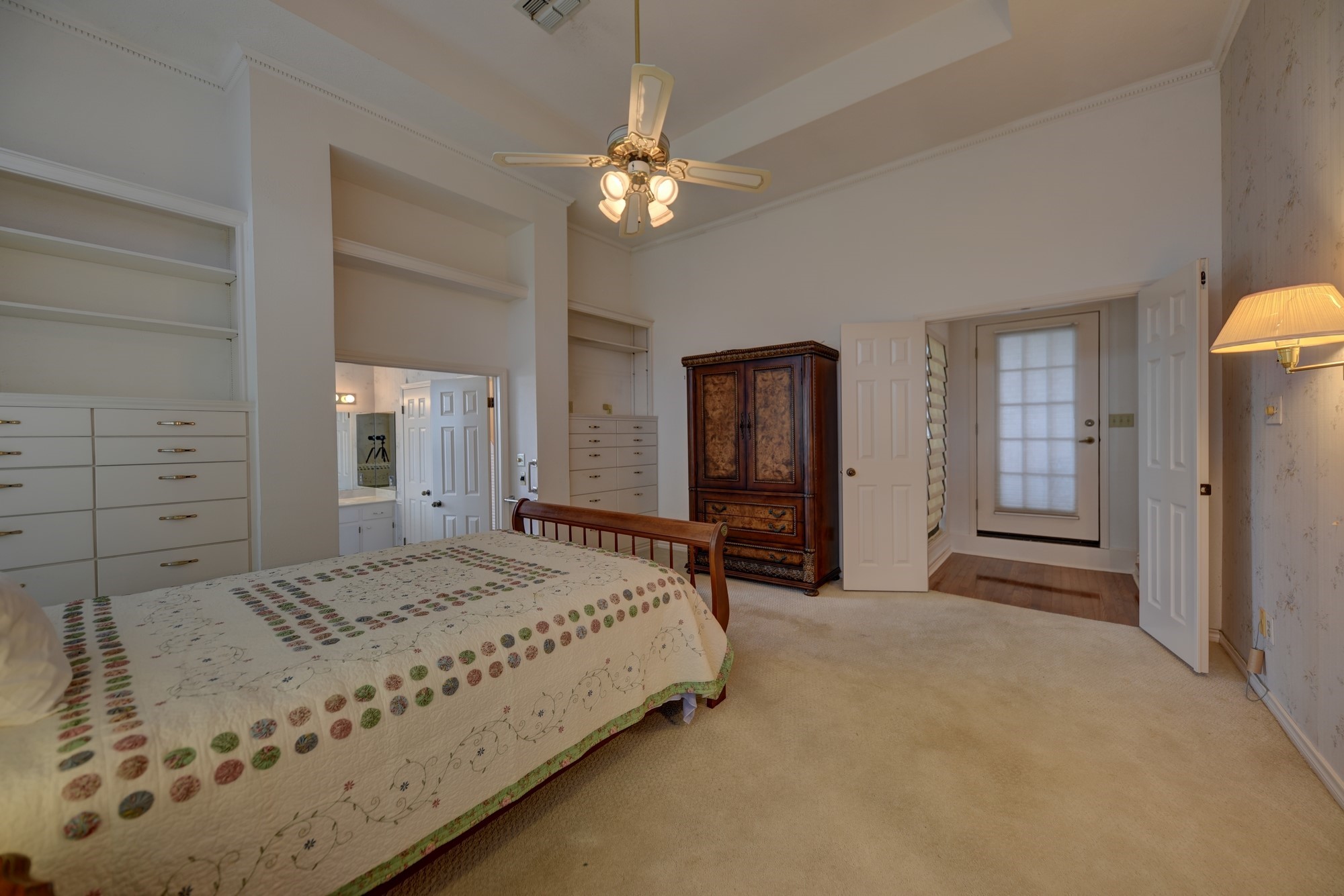 1552 Holub Road Schulenburg, TX 78956 - Photo 15 of 43 a spacious bedroom with a bed and a chandelier