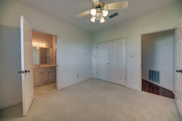a view of an empty room with a bathroom
