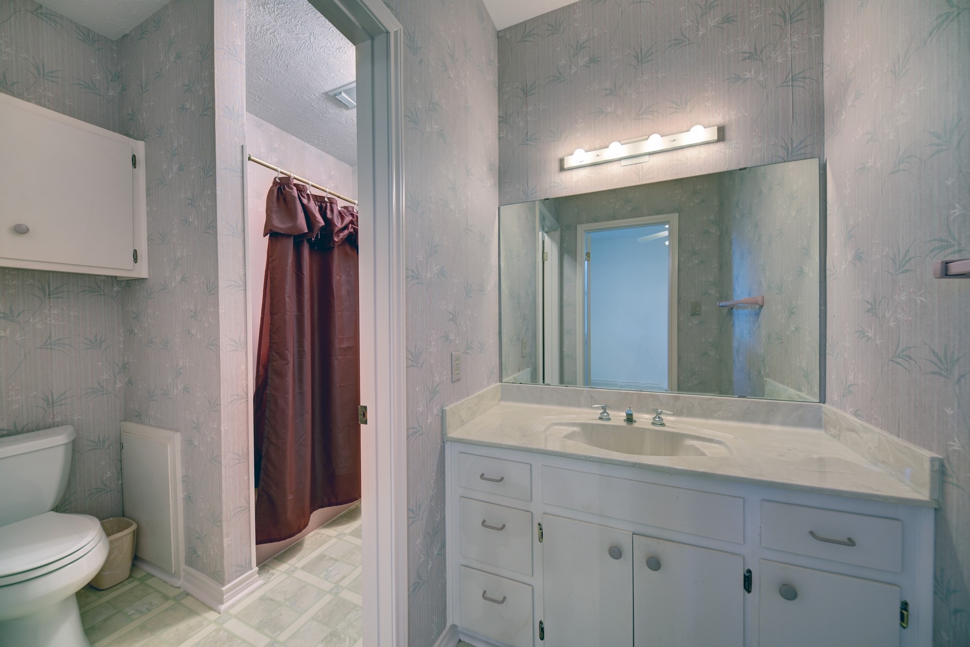 1552 Holub Road Schulenburg, TX 78956 - Photo 24 of 43 a bathroom with a toilet sink and mirror