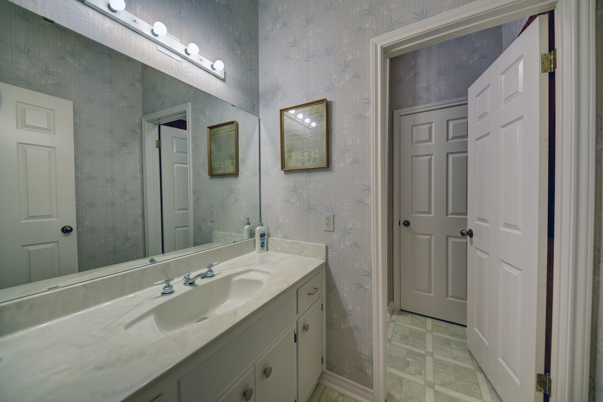 1552 Holub Road Schulenburg, TX 78956 - Photo 25 of 43 a bathroom with a double vanity sink and mirror