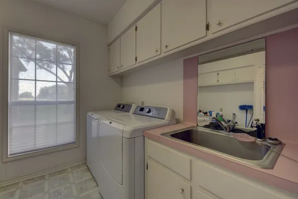a utility room with dryer and washer