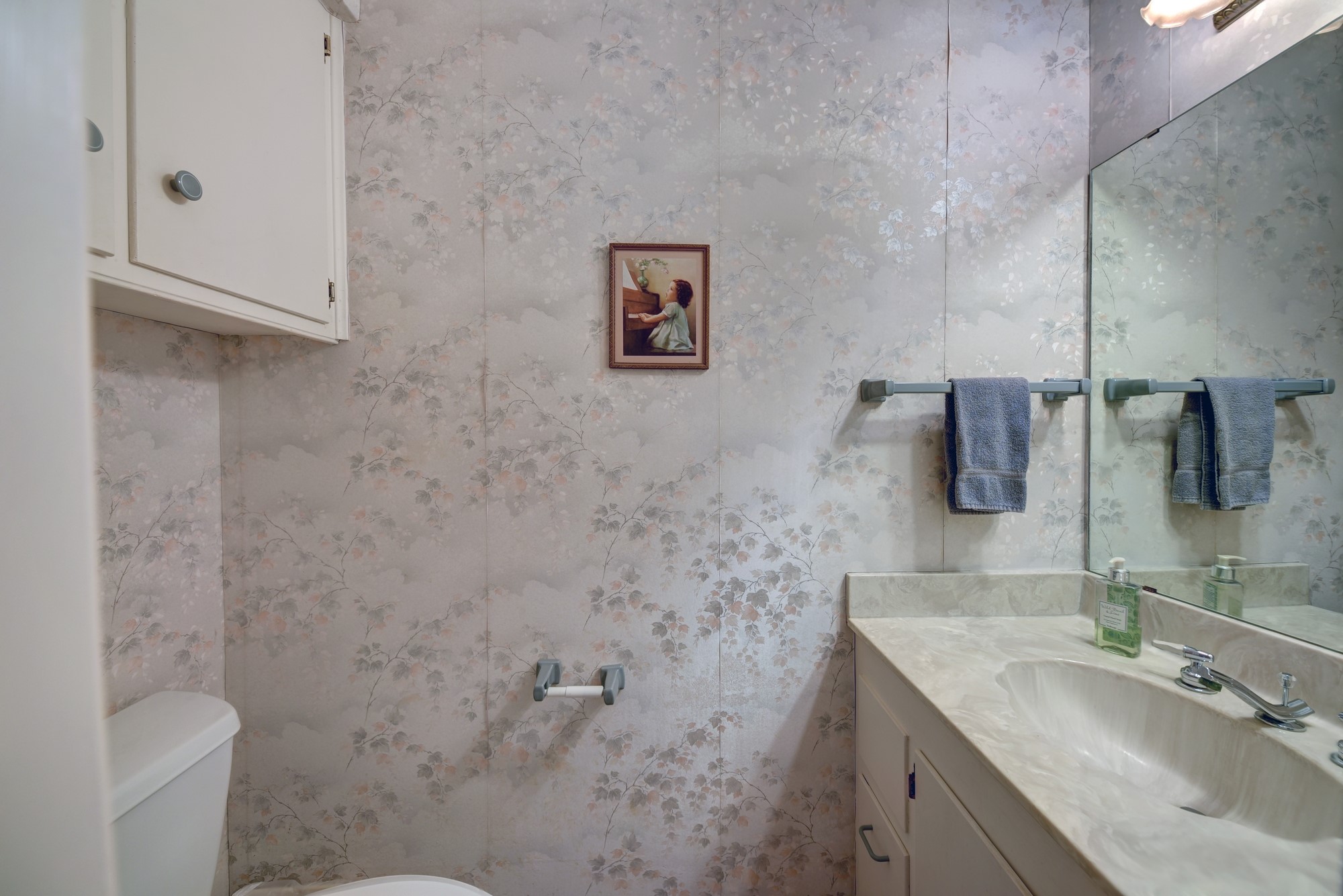 1552 Holub Road Schulenburg, TX 78956 - Photo 27 of 43 a bathroom with a granite countertop sink toilet and mirror