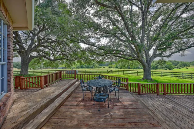 a view of a table and chairs on the roof deck