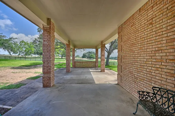 a view of a garden with an outdoor seating