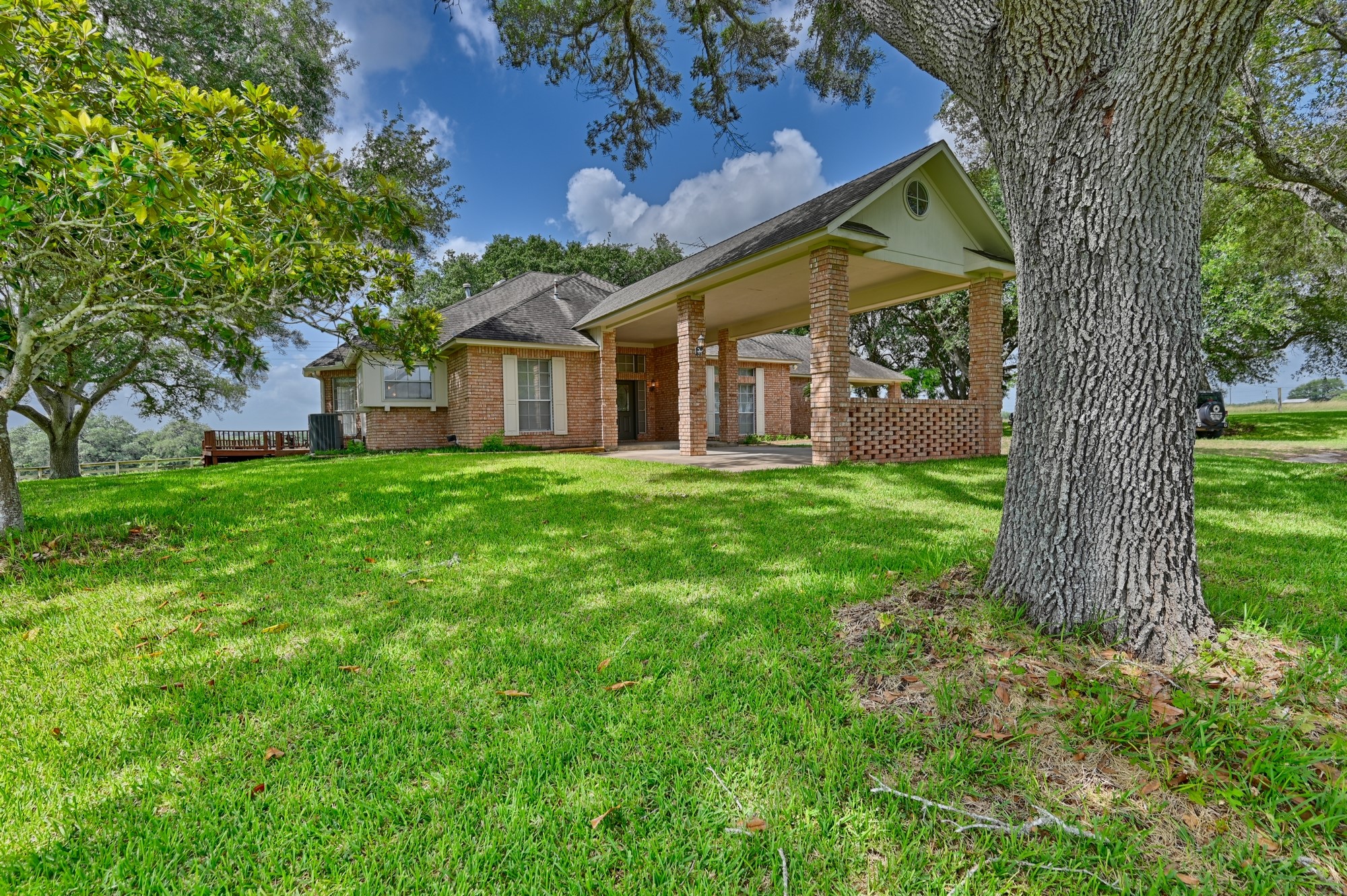 1552 Holub Road Schulenburg, TX 78956 - Photo 4 of 43 a view of a house with a big yard and large tree