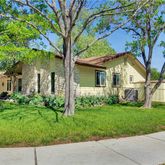 a view of house with a yard