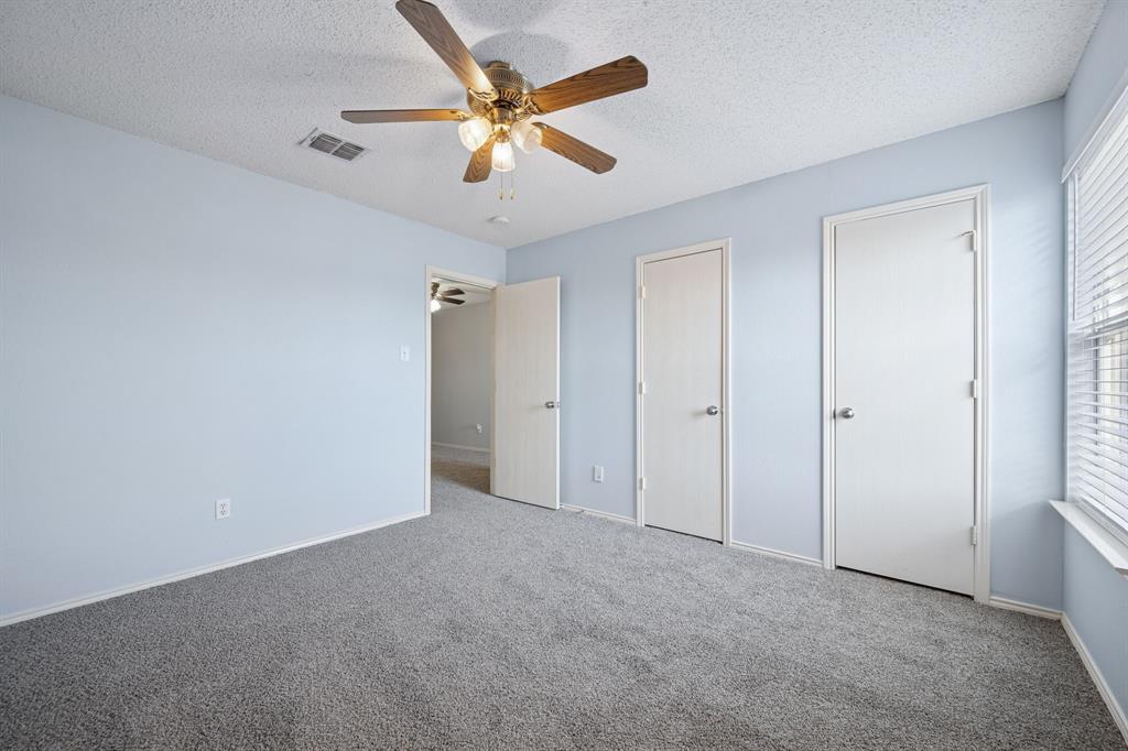 3304 Olympus Court Corinth, TX 76210 - Photo 28 of 40 Bedroom with ceiling fan and closet.