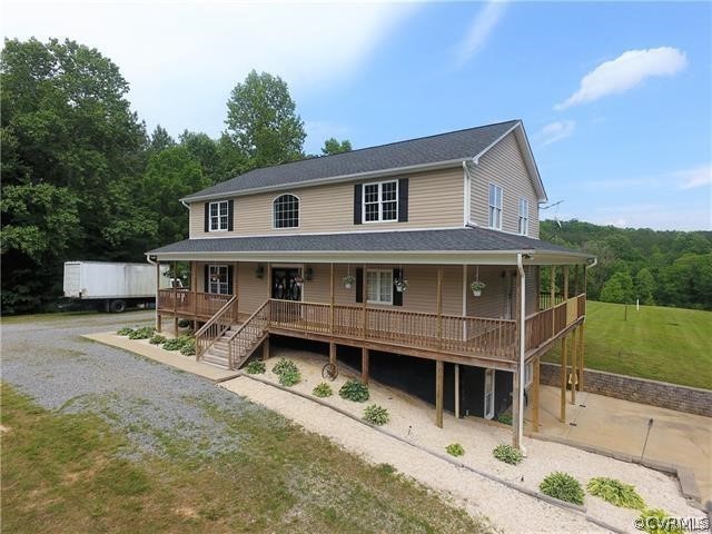 1629 Log Cabin Road Beaverdam, VA 23015 - Photo 1 of 40 a house that has a lot of windows in it