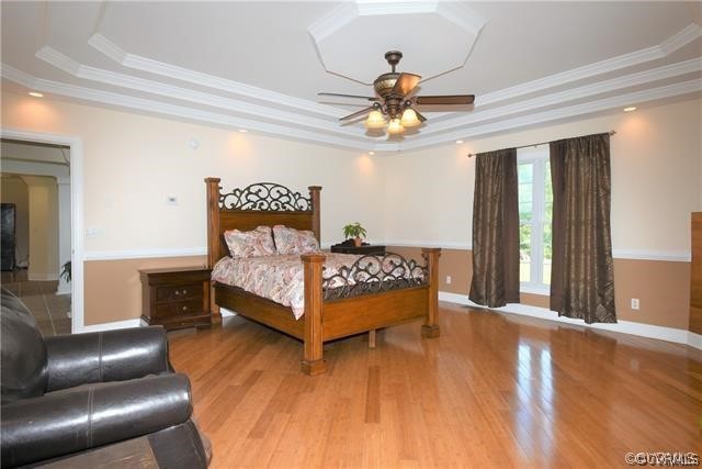 1629 Log Cabin Road Beaverdam, VA 23015 - Photo 20 of 40 a bedroom with a bed and a chandelier
