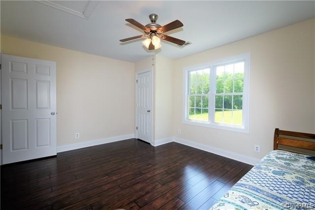 1629 Log Cabin Road Beaverdam, VA 23015 - Photo 27 of 40 a view of an empty room with wooden floor and a ceiling fan