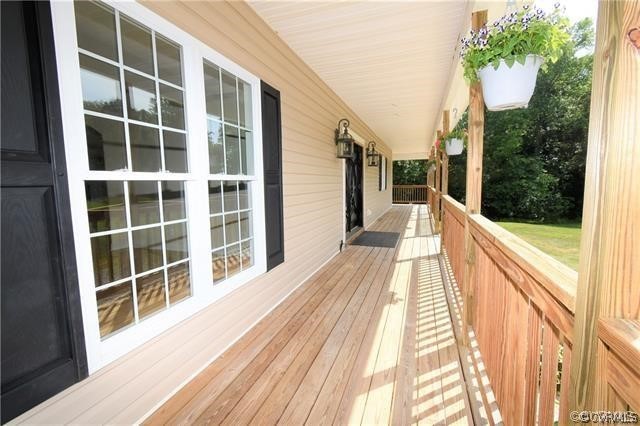 1629 Log Cabin Road Beaverdam, VA 23015 - Photo 38 of 40 a view of balcony with wooden floor and fence