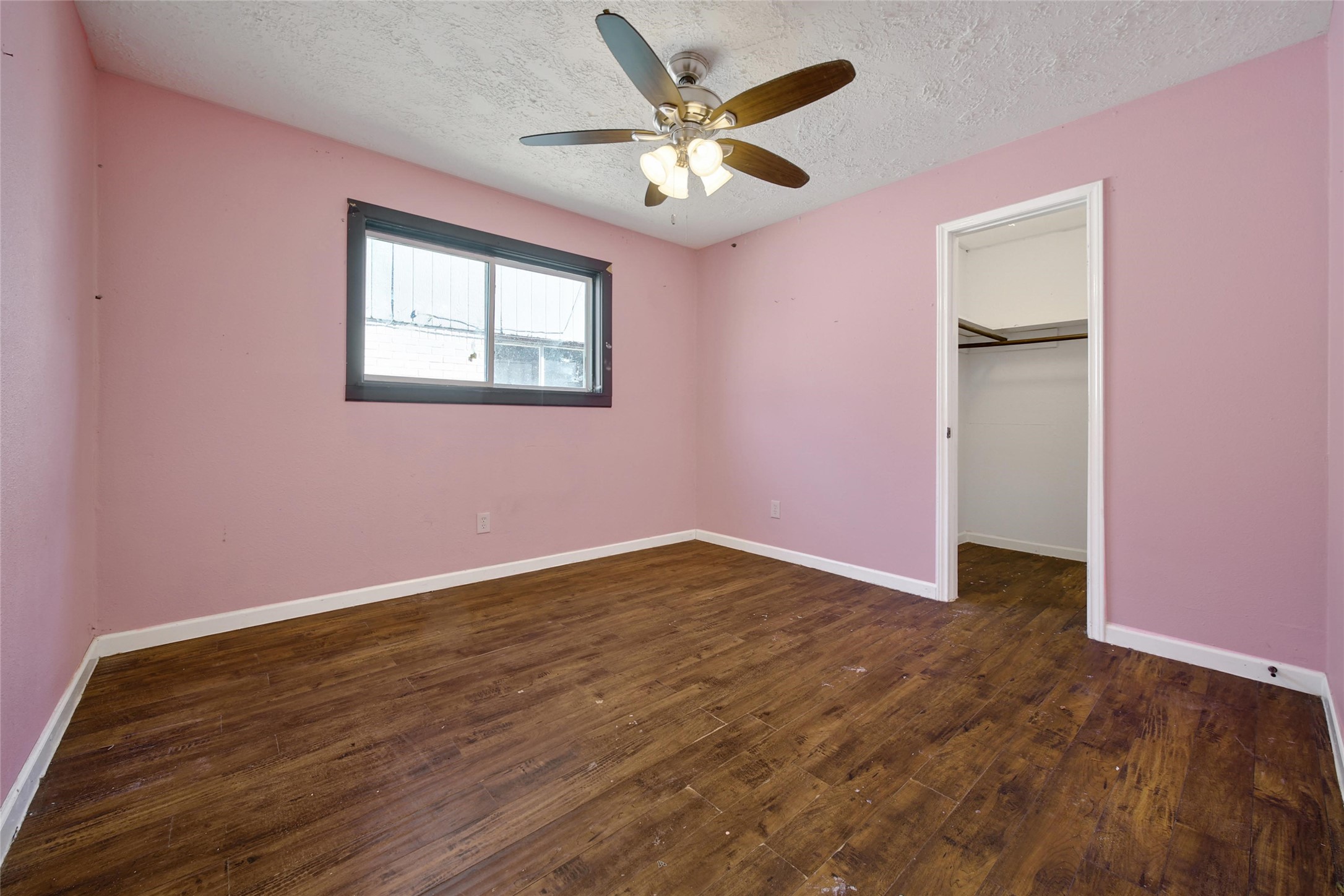 426 North Compass Rose Circle Crosby, TX 77532 - Photo 11 of 13 a view of an empty room with window and wooden floor