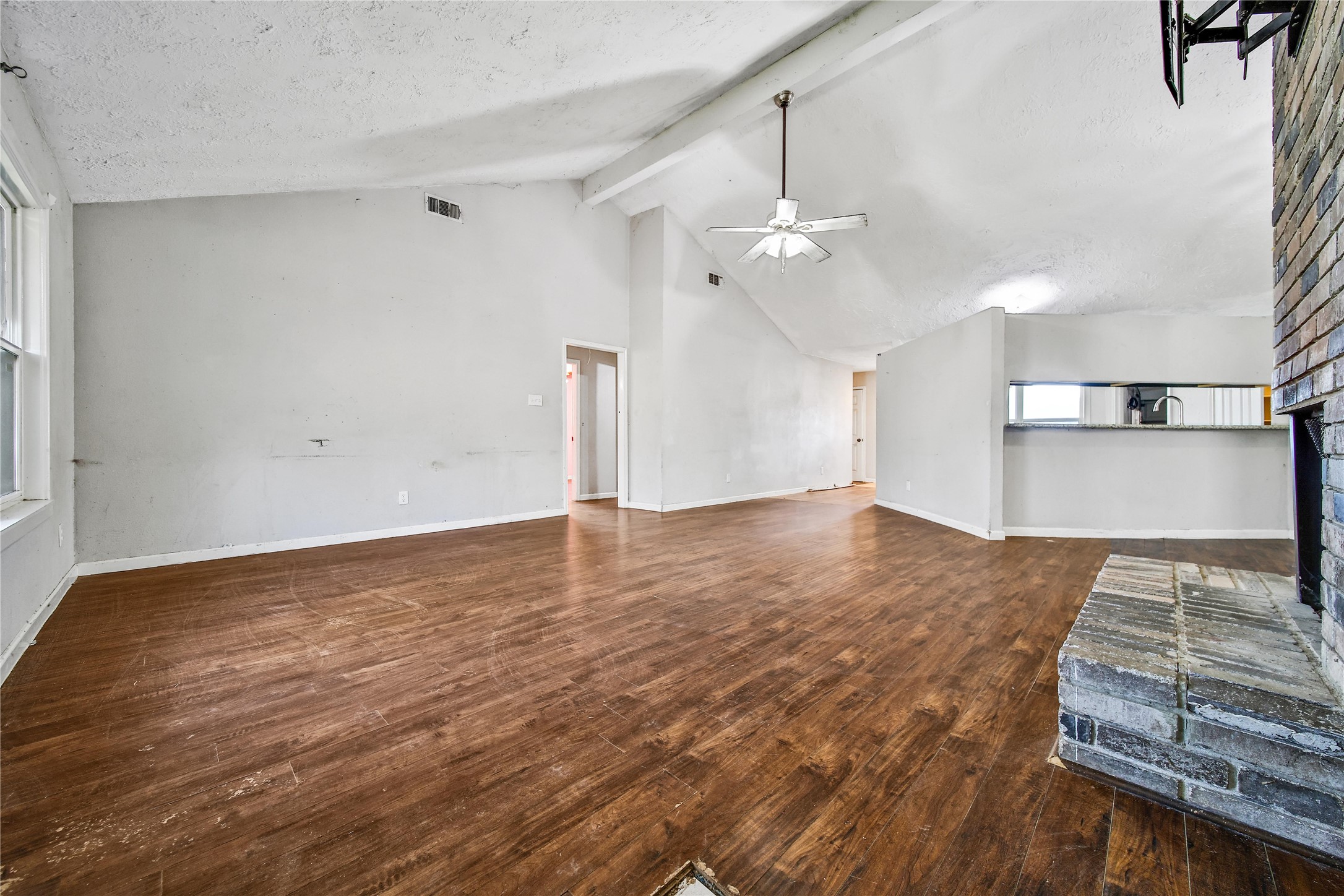 426 North Compass Rose Circle Crosby, TX 77532 - Photo 3 of 13 a view of a room with wooden floor and ceiling fan