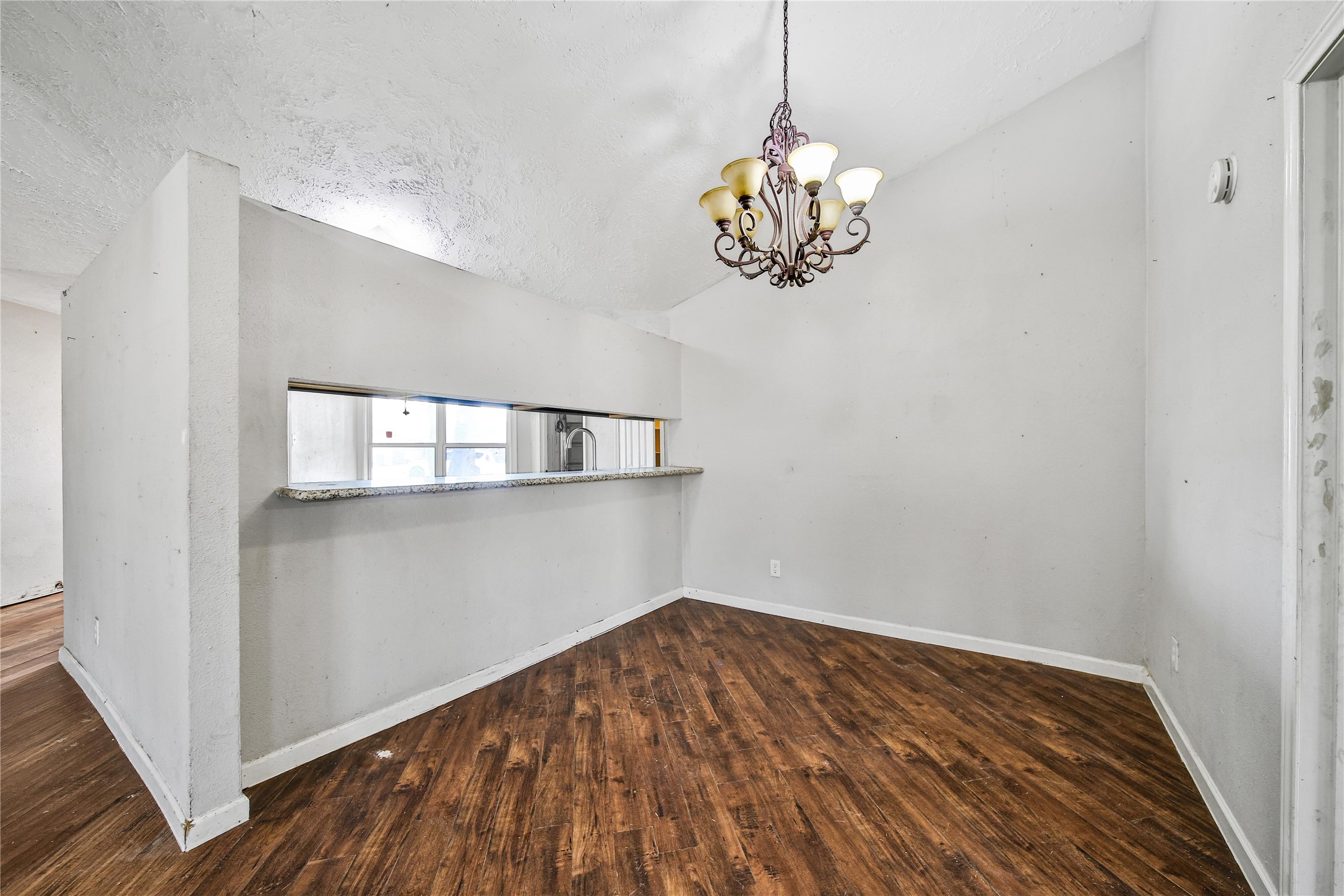 426 North Compass Rose Circle Crosby, TX 77532 - Photo 5 of 13 a view of a room with wooden floor and chandelier