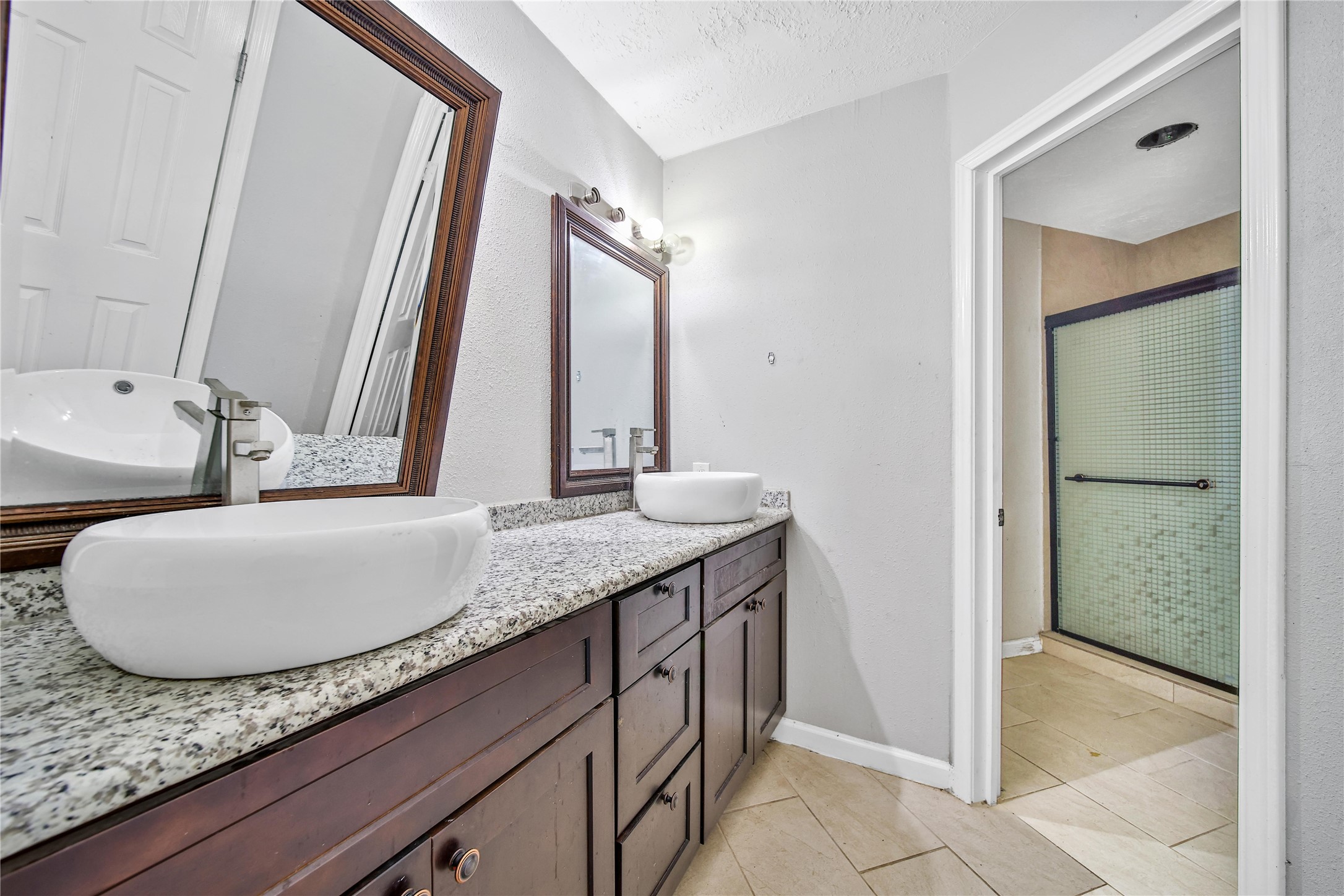 426 North Compass Rose Circle Crosby, TX 77532 - Photo 7 of 13 a bathroom with a granite countertop sink and a mirror