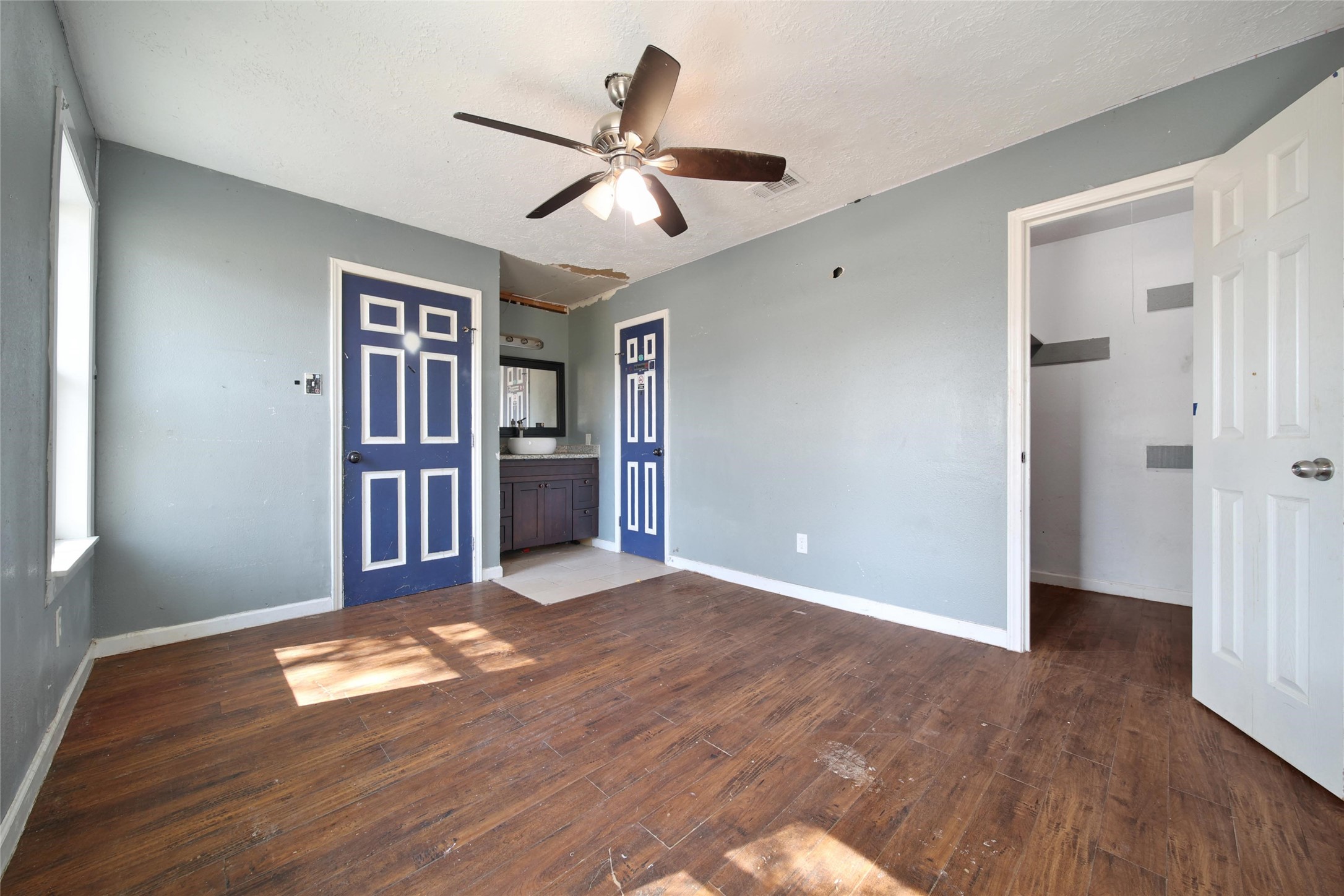 426 North Compass Rose Circle Crosby, TX 77532 - Photo 8 of 13 a view of empty room with wooden floor and fan
