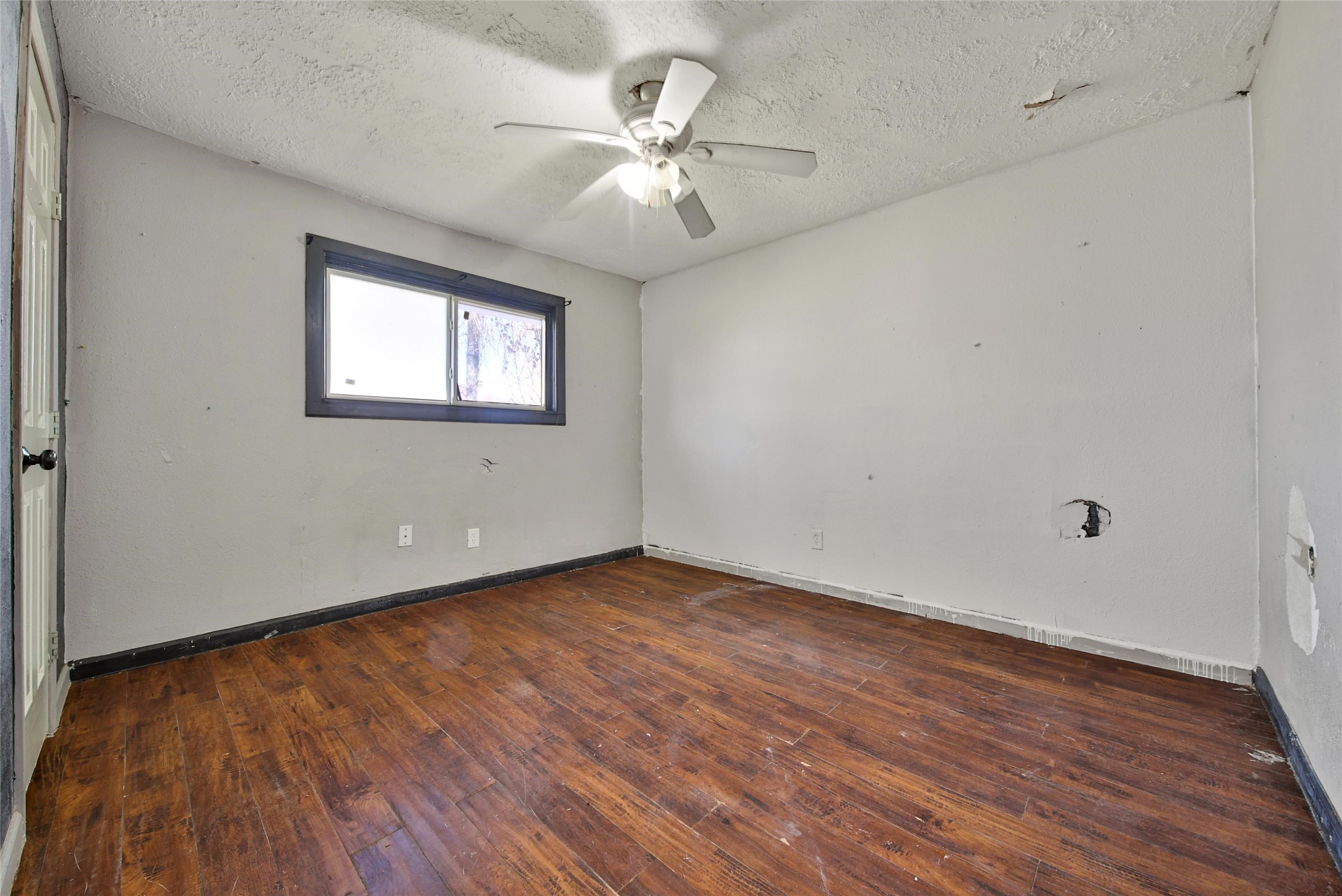 426 North Compass Rose Circle Crosby, TX 77532 - Photo 10 of 13 wooden floor in an empty room with a window