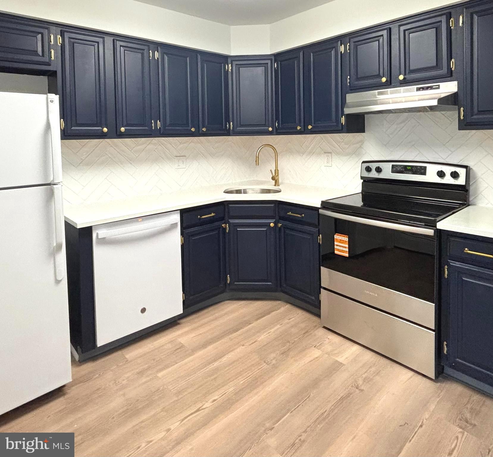 5 Neville Court Sewell, NJ 08080 - Photo 5 of 23 a kitchen with a cabinets and a stove