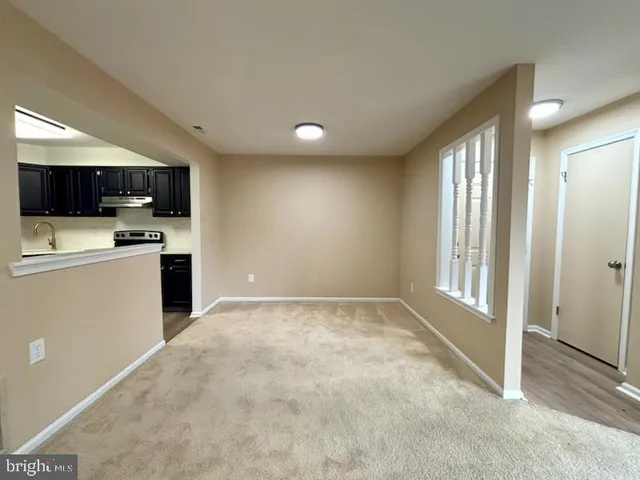 a view of kitchen and kitchen with wooden floor