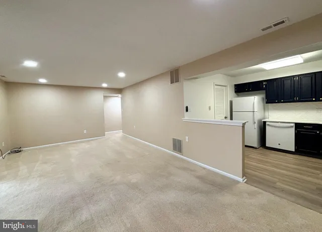 a view of a kitchen with a sink and a stove top oven