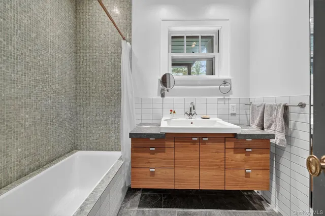 a bathroom with a sink and a bathtub
