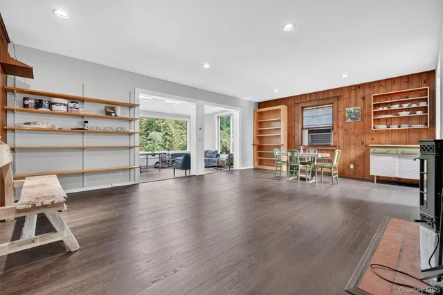 a view of a livingroom with furniture window and wooden floor
