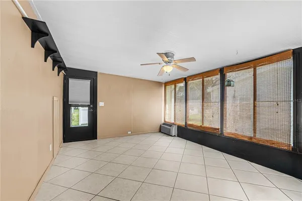 a bedroom with bed and window