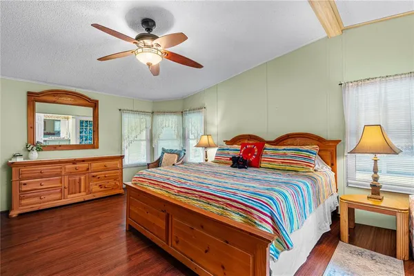 a bathroom with a sink mirror and a shower