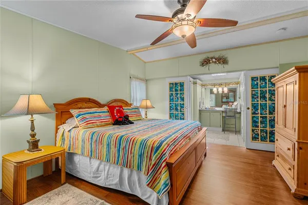 a bathroom with a toilet a sink and shower curtain