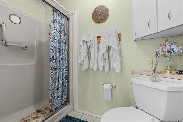 a bathroom with a sink vanity tub and shower