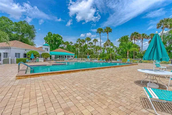 a view of a swimming pool with a porch