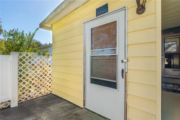 a living room with furniture a rug and a large window