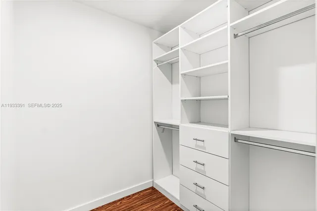 a view of an empty walk in closet