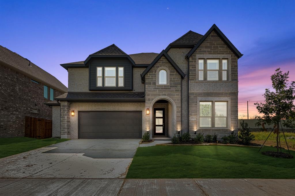 3512 Granite Rapids Road Mesquite, TX 75181 - Photo 2 of 40 a front view of a house with a yard and garage