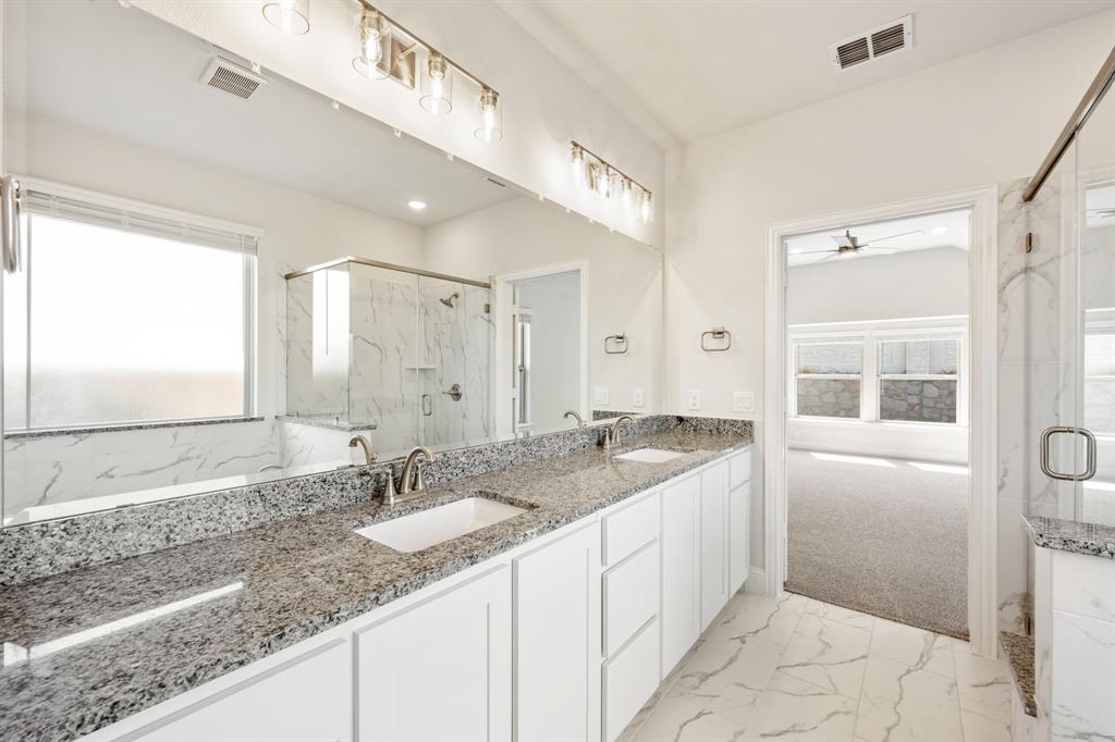 3512 Granite Rapids Road Mesquite, TX 75181 - Photo 23 of 40 a bathroom with a granite countertop sink mirror and double