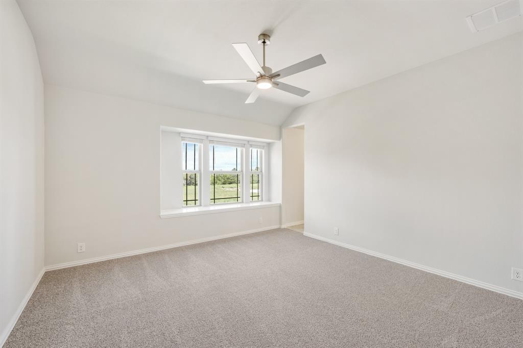 3512 Granite Rapids Road Mesquite, TX 75181 - Photo 32 of 40 an empty room with a window and a fan