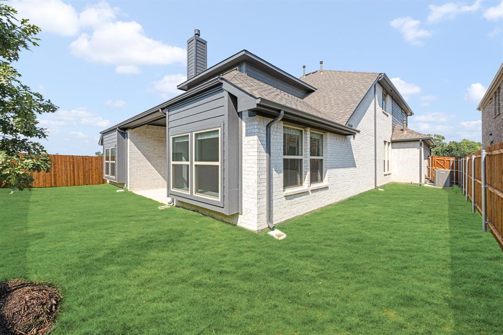 3512 Granite Rapids Road Mesquite, TX 75181 - Photo 39 of 40 a view of a house with a yard