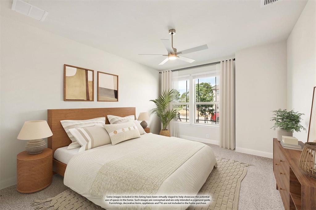 3512 Granite Rapids Road Mesquite, TX 75181 - Photo 6 of 40 a bedroom with a large bed and a chandelier