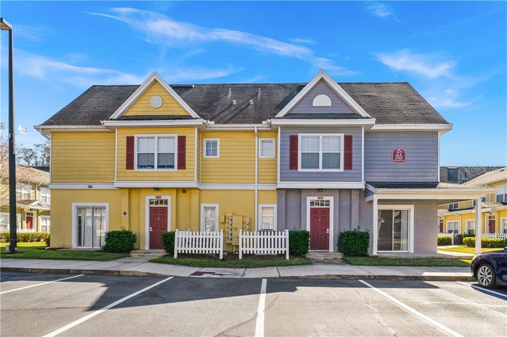 4560 Yellowgold Road East, Unit 107 Kissimmee, FL 34746 - Photo 1 of 1 a front view of multiple houses