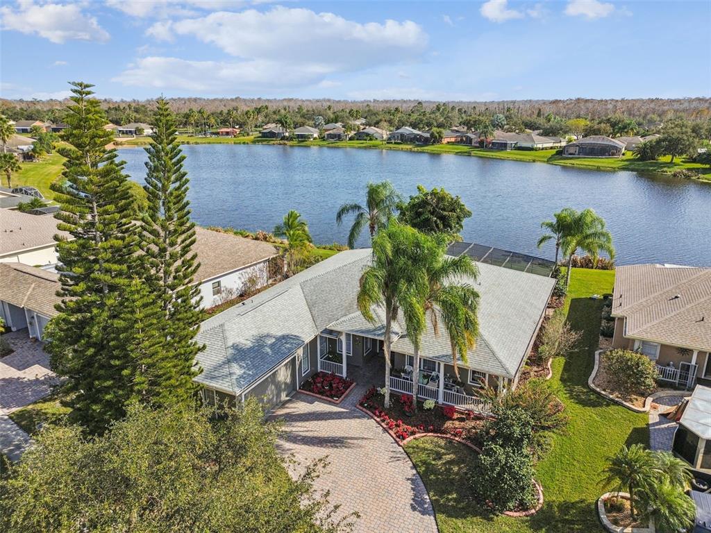 an aerial view of a house with a lake view