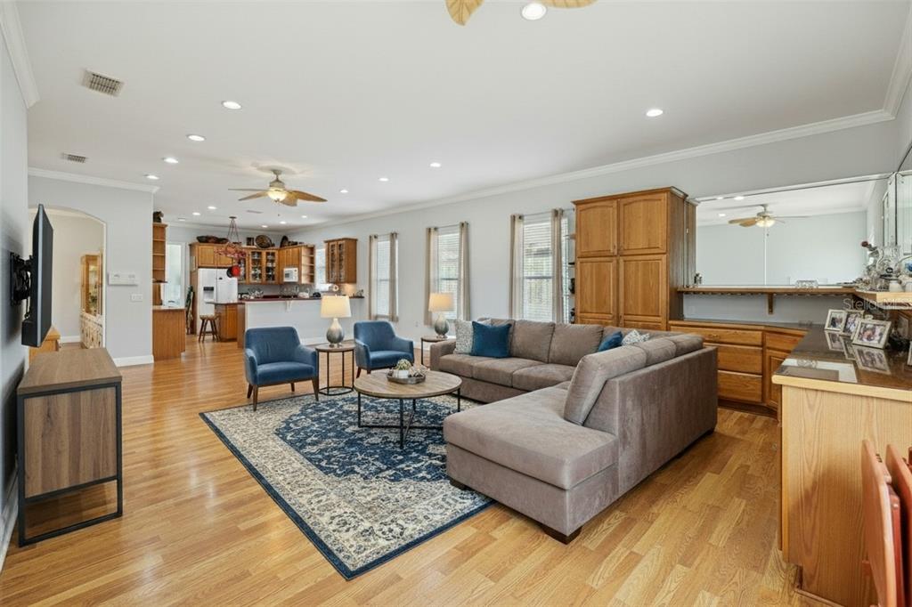 801 Glendora Road Kissimmee, FL 34759 - Photo 13 of 74 a living room with furniture rug and kitchen view