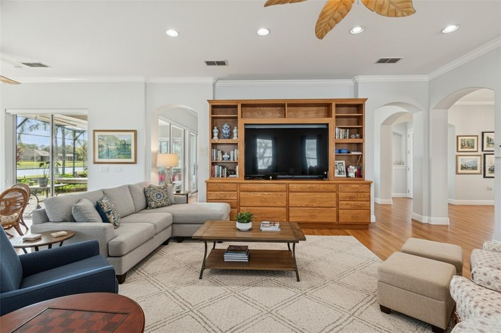 801 Glendora Road Kissimmee, FL 34759 - Photo 15 of 74 a living room with furniture and a fireplace